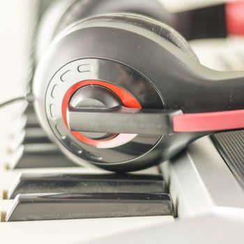 headphones on electric  music instrument piano keyboard
