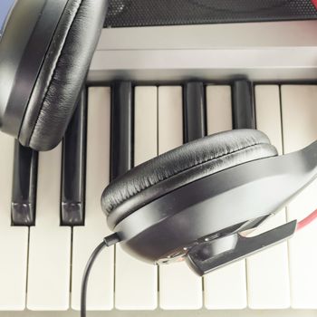 headphones on electric  music instrument piano keyboard