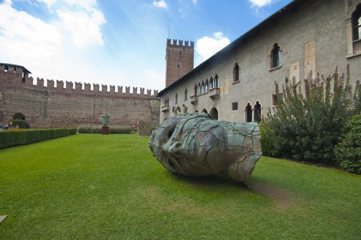 One of Igor Mitoraj's sculptures in the inner yard of Castelvecchio. Italy