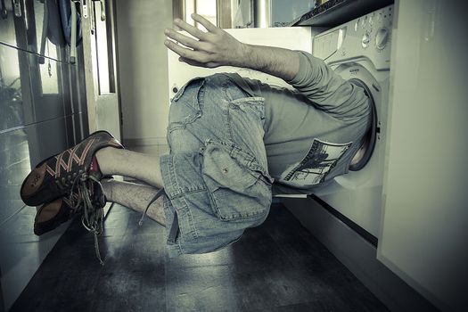 man flying with his head stuck in a washing machine