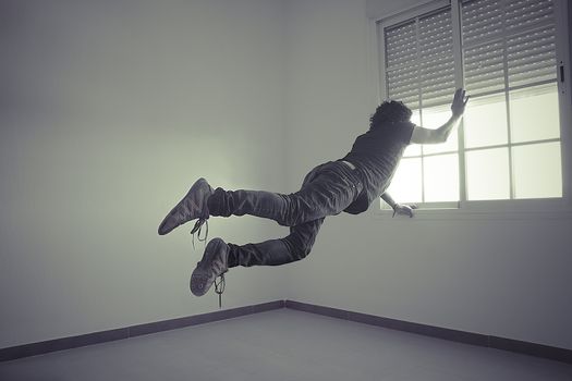 man flying into a window, concept of freedom and imagination