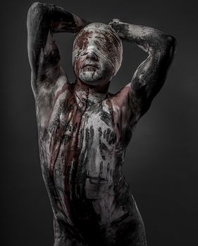 man with blood and blindfolded concept of prison, without freedom