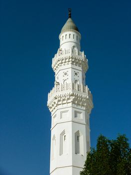 Minaret of Quba mosque with blue sky background