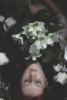 Innocence, Teen submerged in water with white roses, romance scene