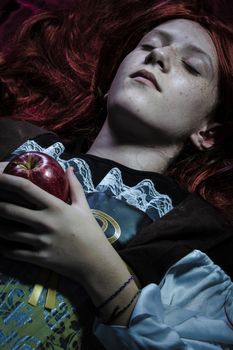 Magic, Teen with a red apple lying, tale scene