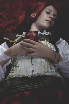 Dramatic, Teen with a red apple lying, tale scene