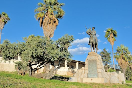 Equestrian rider statue and Alte Feste, oldest building in Windhoek,  Namibia

