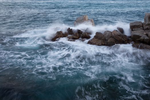 splashing wave and rock, long exposure