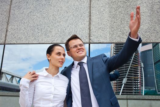 Successful business couple near the business center