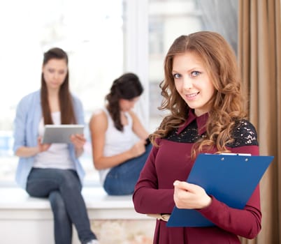 Portrait of pretty girl looking at camera in college