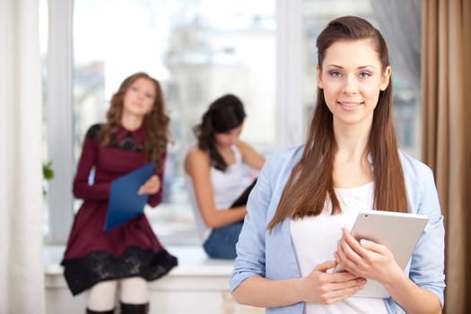 Portrait of smiling  girl looking at camera in college