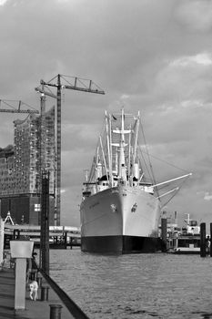 The Cap San Diego in front of the Philharmonic Hall in the port of Hamburg.