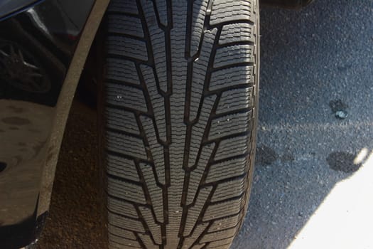 At the parking lot of a car tire