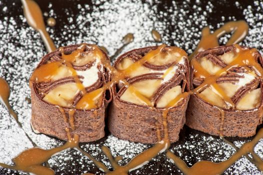Chocolate roll with various caramel and cream