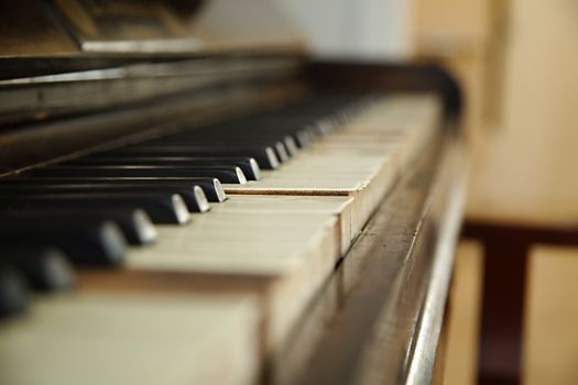 Old piano with faded keys