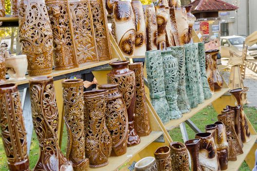 ceramic clay vase with carved floral ornaments of nature in village fair