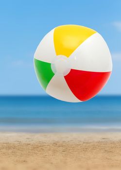 Colorful ball on a sandy beach