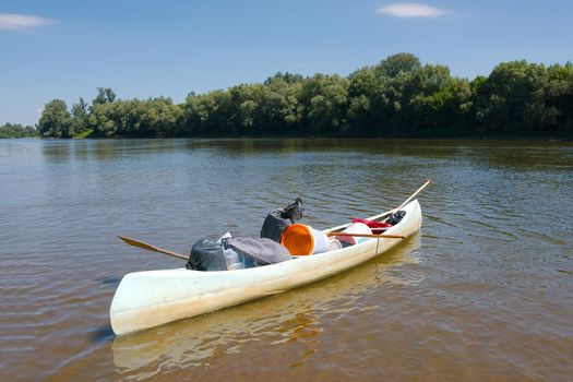 Canoe parked on the riverside