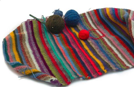 This photo shows the yarn for knitting yarn and fabric related. Also in the photograph depicted knitting needles and crochet hook. This photograph was taken in artificial light photoelectric cell, was used when shooting a tripod.
