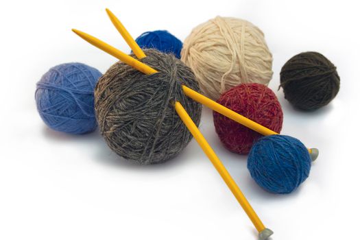 This photo shows the yarn for knitting yarn and fabric related. Also in the photograph depicted knitting needles and crochet hook. This photograph was taken in artificial light photoelectric cell, was used when shooting a tripod.