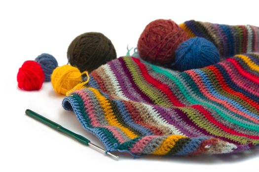 This photo shows the yarn for knitting yarn and fabric related. Also in the photograph depicted knitting needles and crochet hook. This photograph was taken in artificial light photoelectric cell, was used when shooting a tripod.