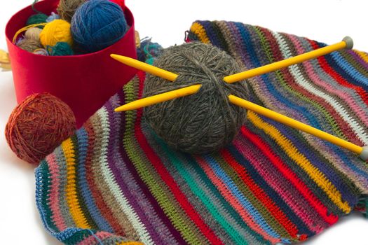This photo shows the yarn for knitting yarn and fabric related. Also in the photograph depicted knitting needles and crochet hook. This photograph was taken in artificial light photoelectric cell, was used when shooting a tripod.