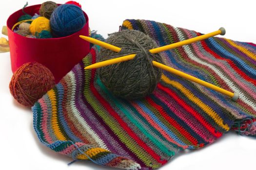 This photo shows the yarn for knitting yarn and fabric related. Also in the photograph depicted knitting needles and crochet hook. This photograph was taken in artificial light photoelectric cell, was used when shooting a tripod.
