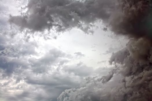 Background abstract image in the form of an overcast cloudy sky gray tones