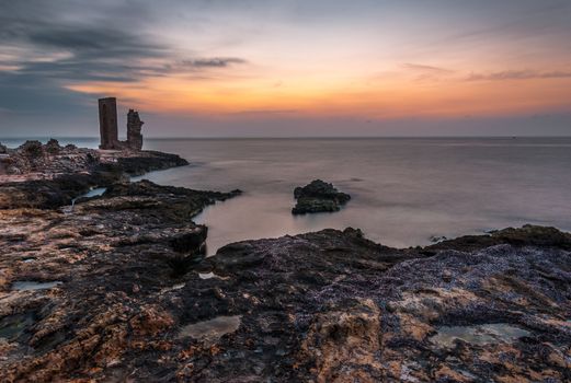 Sunset over the Sea and Rocky Coast with Ancient Ruins and Gate to Africa in Mahdia, Tunisia