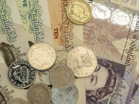 LONDON, UNITED KINGDOM - CIRCA APRIL 2014: British Sterling Pounds (GBP) banknotes and coins bearing the portrait of Queen Elizabeth II