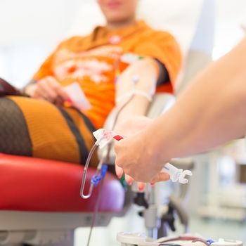 Role of nurses in blood services and donor sessions.  Nurse and blood donor at donation.
