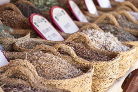 Herbal, wicker baskets stuffed medicinal healing herbs