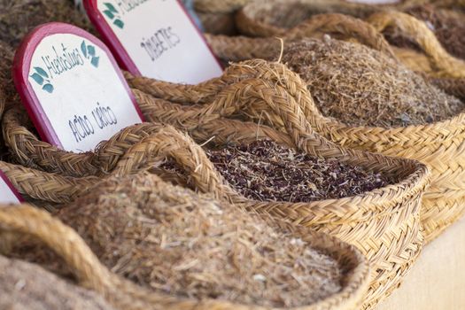 Medical, wicker baskets stuffed medicinal healing herbs