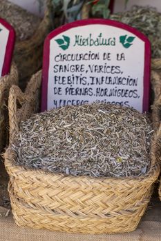 Dried, wicker baskets stuffed medicinal healing herbs