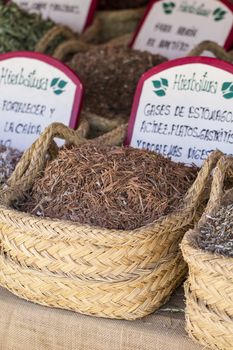 Apothecary, wicker baskets stuffed medicinal healing herbs