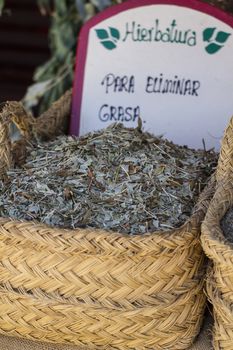 Healthcare, wicker baskets stuffed medicinal healing herbs