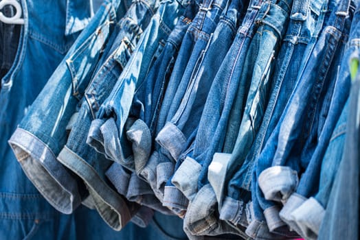 jeans hanging on hangers