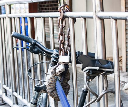 lock bicycle beside the road 