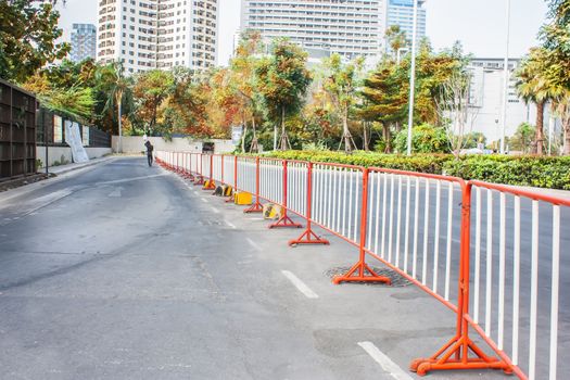 traffic fence on a parking lot in the park.