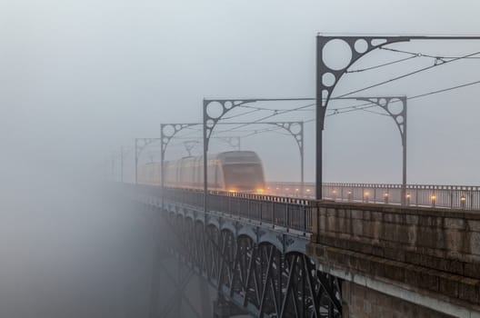 Morning fog on Eiffelbridge in Porto