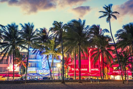 Miami Beach, Florida hotels and restaurants at sunset on Ocean Drive, world famous destination for it's nightlife. January 24, 2014. Special photographic processing.