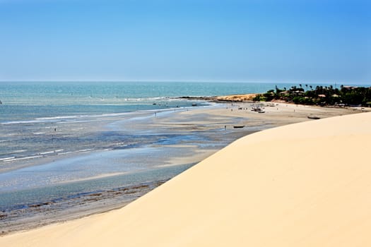view of the big sand dune of the beautiful fisherman village of Jericoacoara in ceara state brazil
