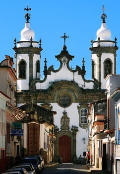 Minas Gerais, Brazil - February 18, 2014: church at the end of the road in the typical town of Sao Joao del Rei
