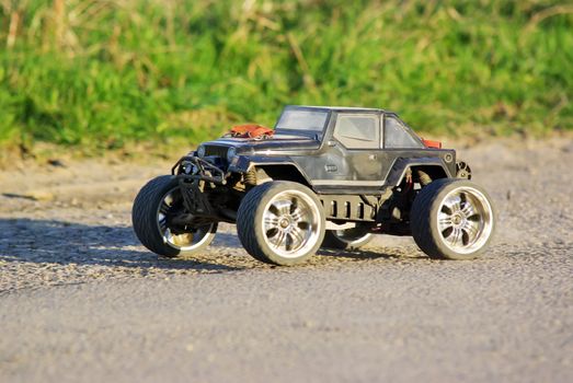 Electric off-road car, radio controlled model on the ground