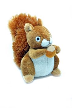 Little red squirrel toy isolated over a white background.