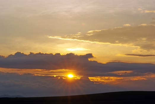 Sky colors at sunset over the hill