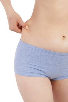 Weight loss and diet. Sexy woman in panties holding hips isolated on white background. 