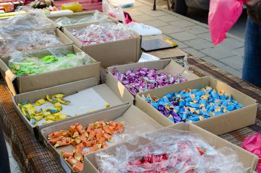 milky caramel candy colored pieces of paper in cardboard boxes