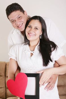 pregnant women with her husband waiting for her baby