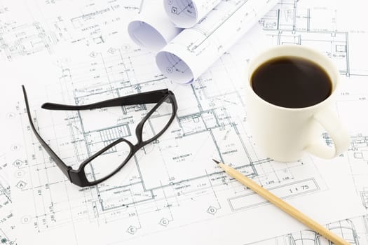 house blueprints and floor plan with glasses and coffee, architecture business concepts and ideas